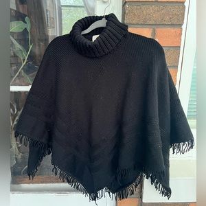 Black turtleneck fringe sweater poncho